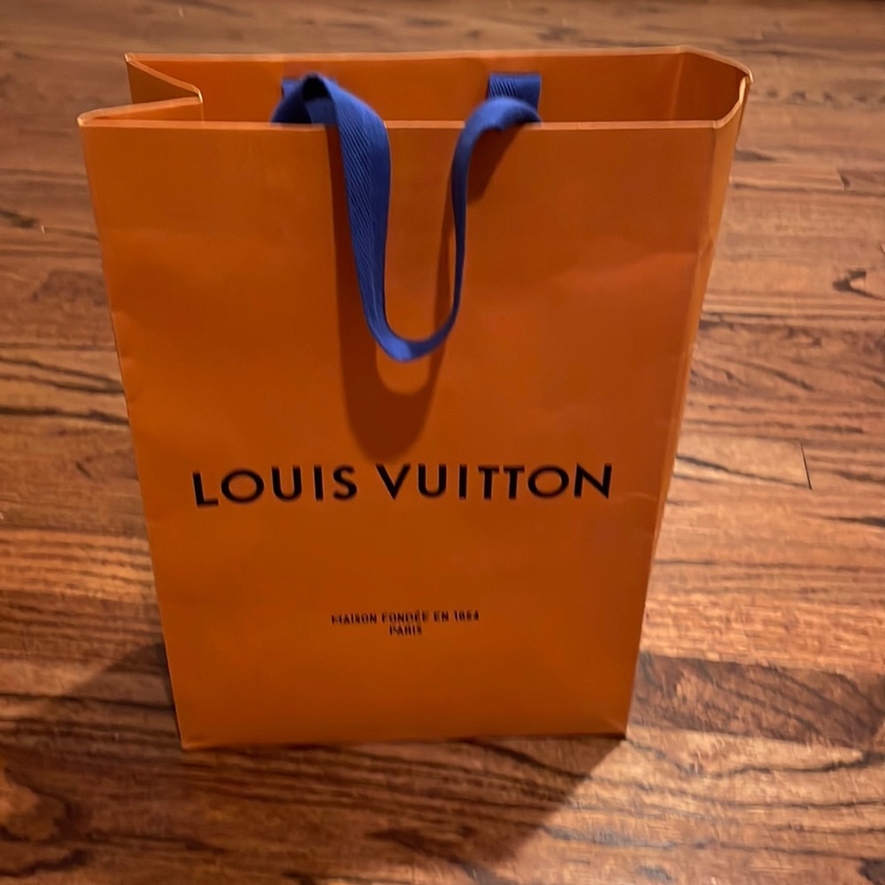 Lou’s Vuitton paper bag